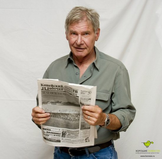 Harrison Ford with the Russian newspaper