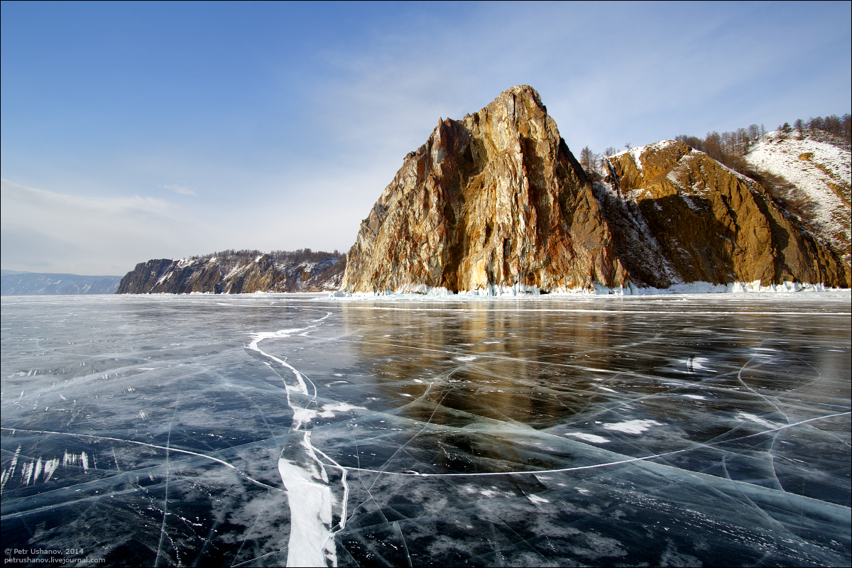 Crystal clear ice of the frozen Baikal Lake · Russia Travel Blog