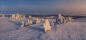 Snow Covered Stone Pillars of Ulakhan-Sis · Russia Travel Blog