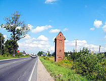 Typical narrow road with a tree in Kaliningrad oblast