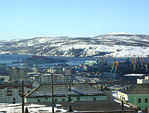 Winter in the ice-free seaport of Murmansk and the opposite shore of the Kola Bay